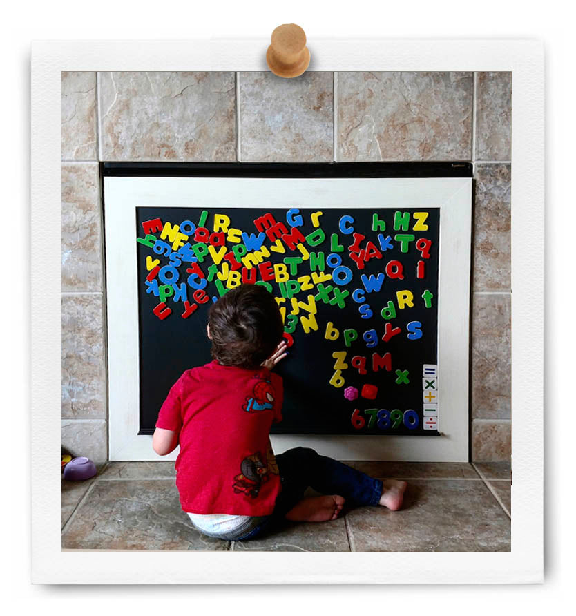 Custom CHalkboard built to fit over a fireplace